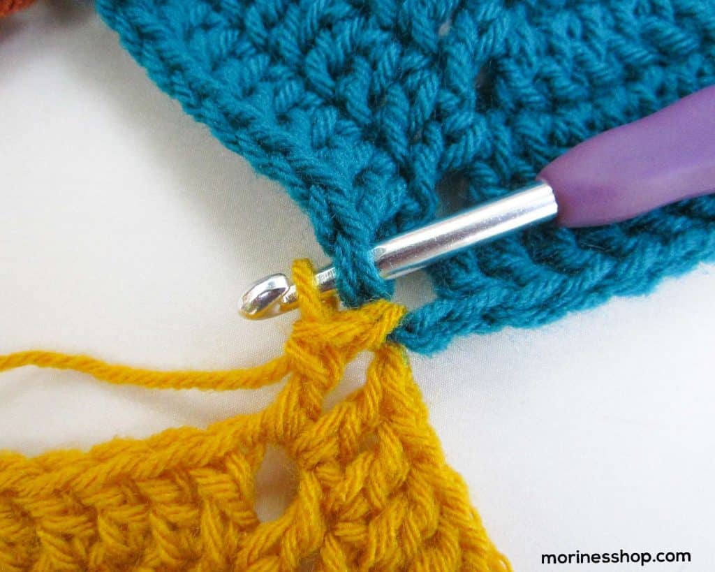 Plzce hook through dc and current stitch.