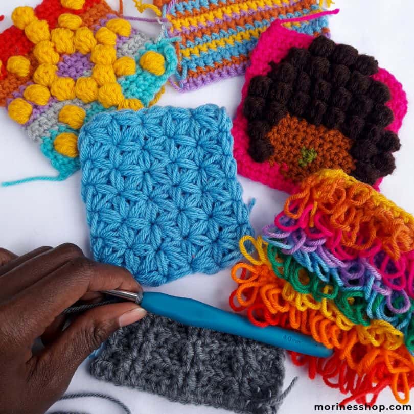 The Hisi Sensory Toy is a free crochet pattern that uses yarn scraps to make a fun colourful texture toy perfect for stimulating senses! #CrochetSensoryToy #SensoryToy #CrochetToy